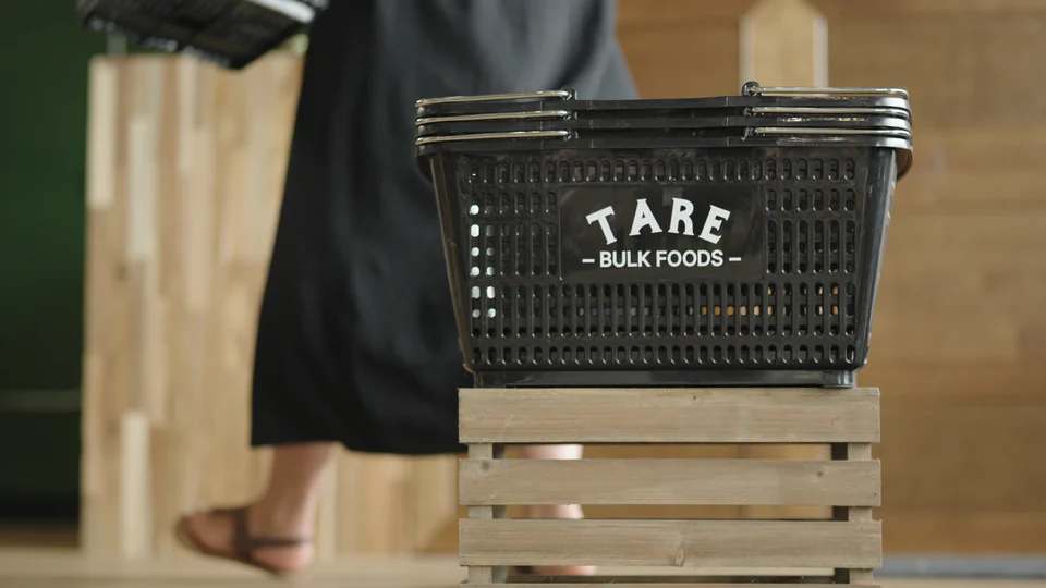 Stack of shopping baskets at Tare Bulk Foods