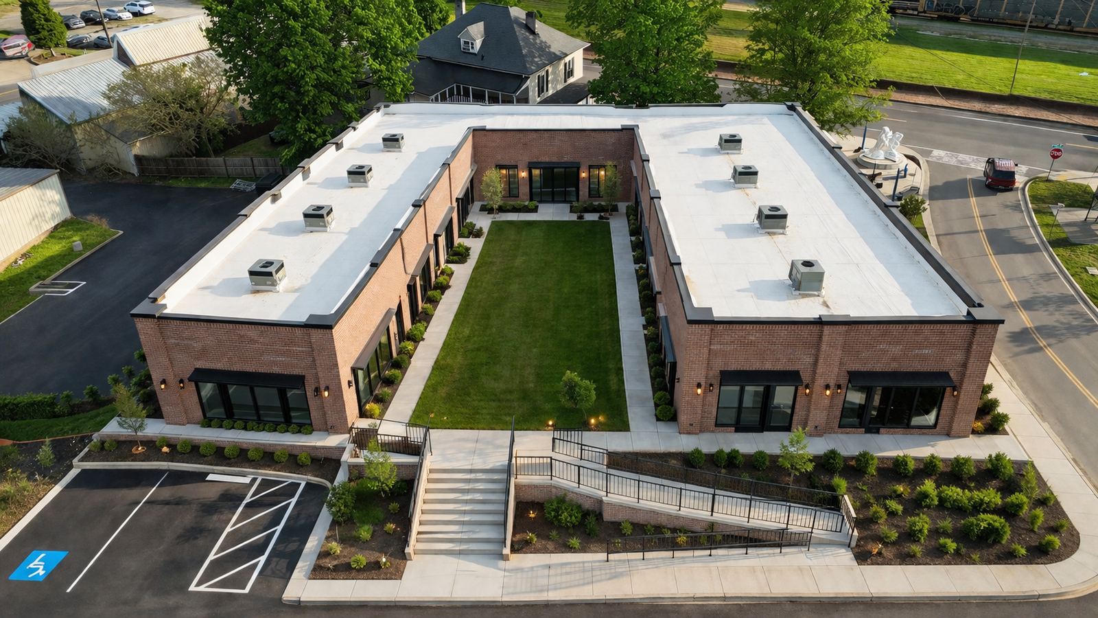 Aerial view of the brick building and courtyard at 1211 South Garden Street in Columbia, Tennessee